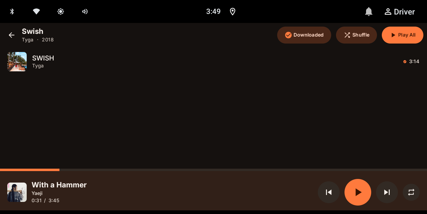 AuxWire's album screen showing a Downloaded badge and offline checkmark